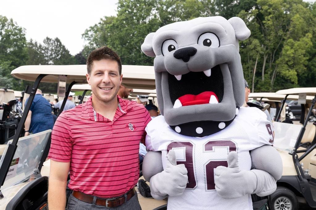 Champ and a corporate partner at a golf event