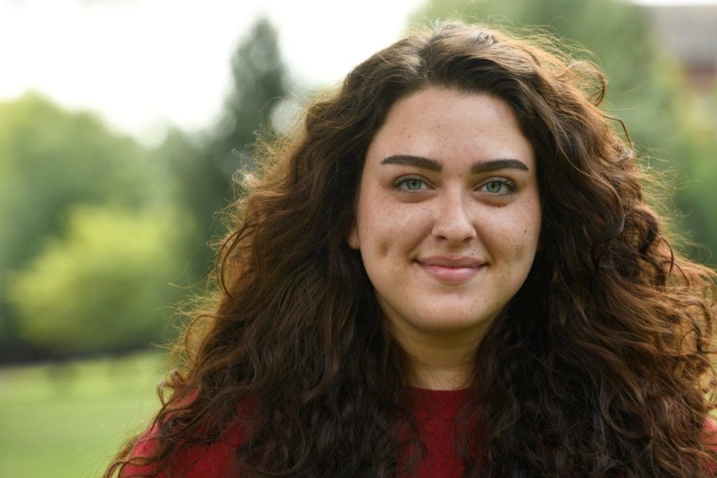 A headshot of a TSCT student outside in the sun looking at the camera. 