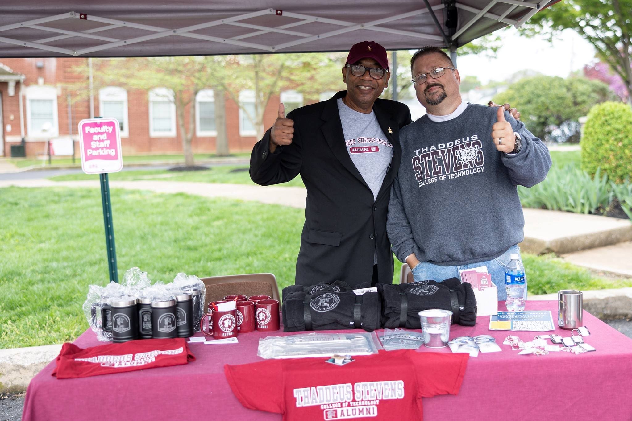 Two alumni are ready to greet attendees at the Fall Open House!
