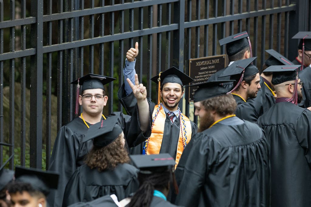 Students ready for graduation at Thaddeus Stevens College wearing caps and gowns.