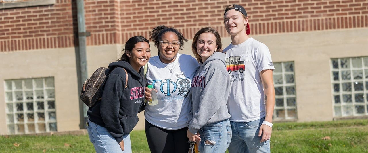 Four Thaddeus Stevens College of Technology students smiling for a photo outside