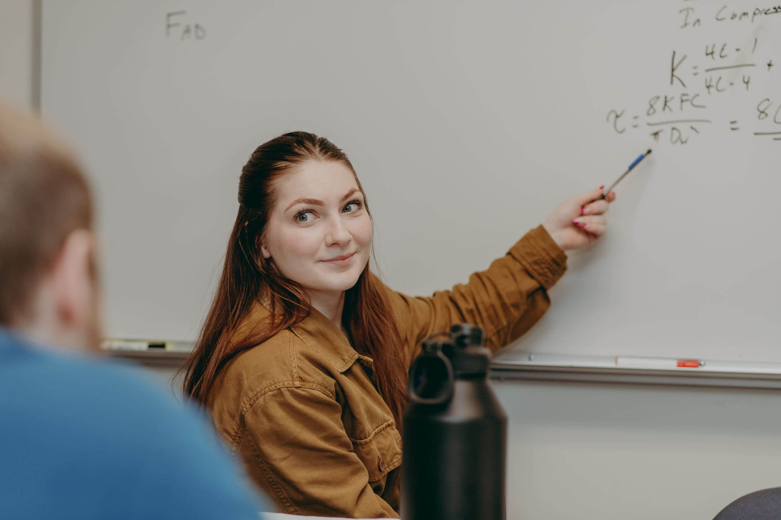 A student sharing information on the whiteboard