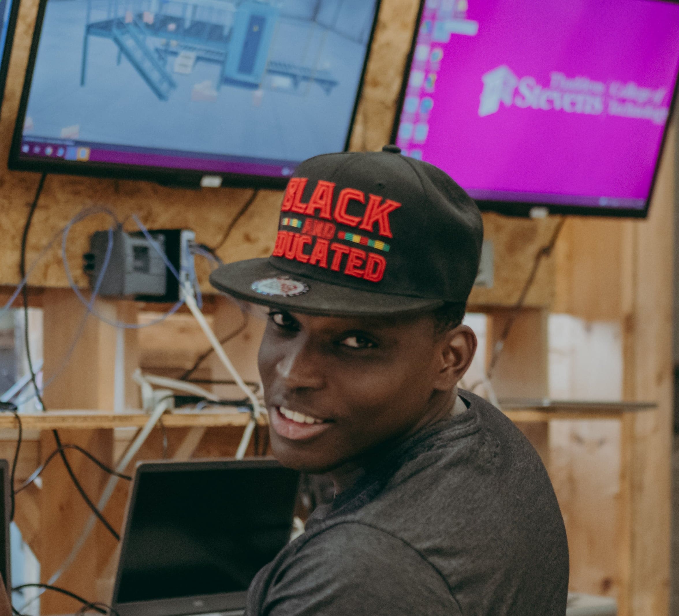 Student in electro-mechanical technology program smiles at camera