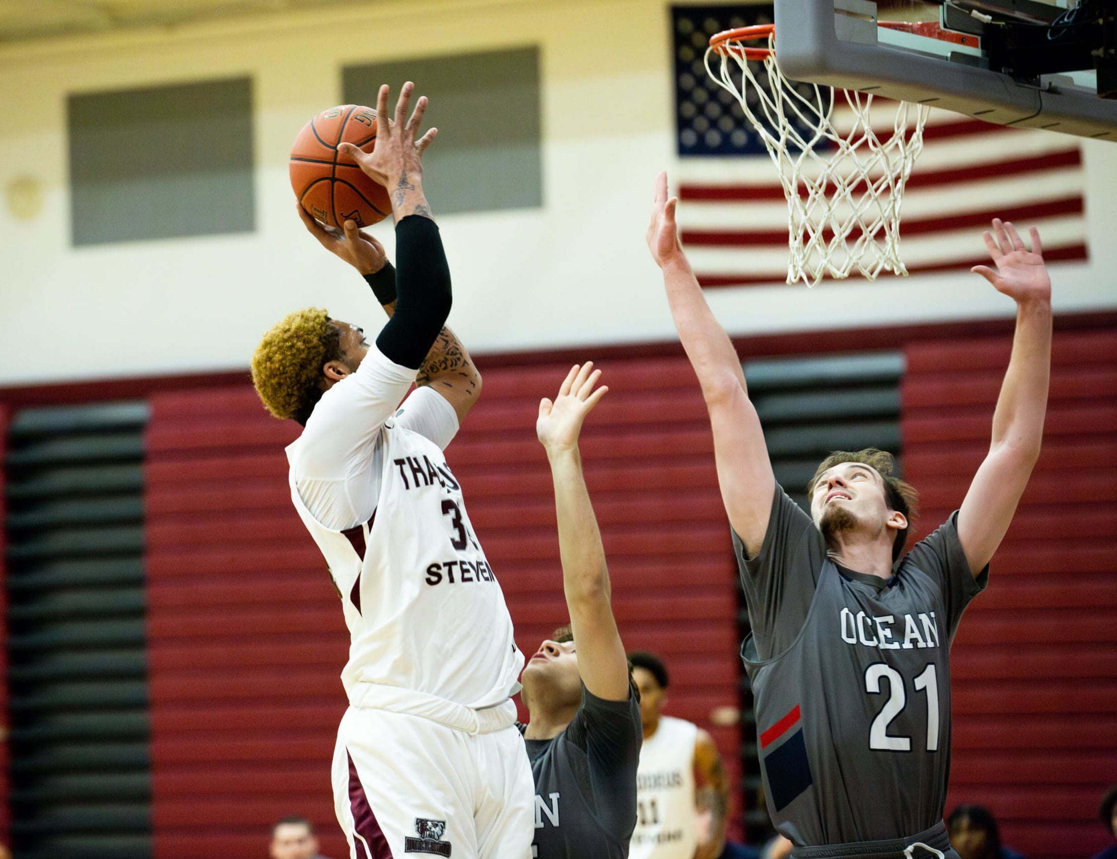 A basketball player at Thaddeus Stevens College makes a layup during a game. 