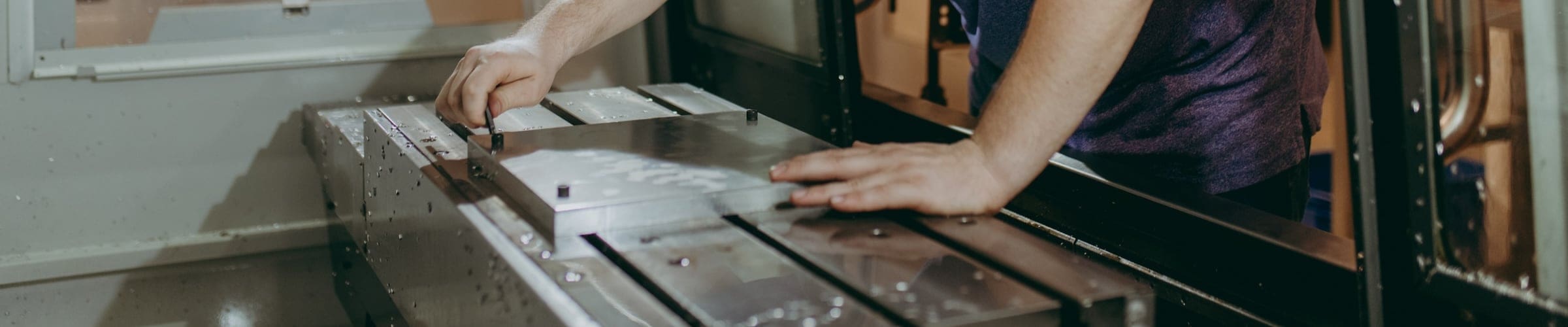 Thaddeus Stevens College Computer Integrated Machining student working on machine 