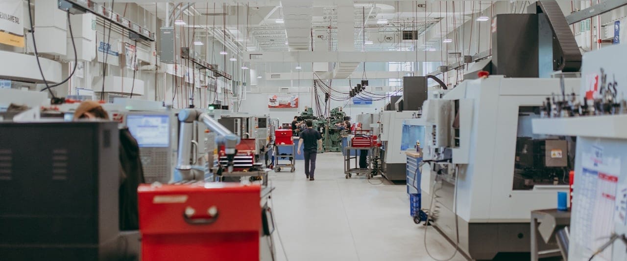 Thaddeus Stevens College Computer Integrated Machining lab space with students in the background