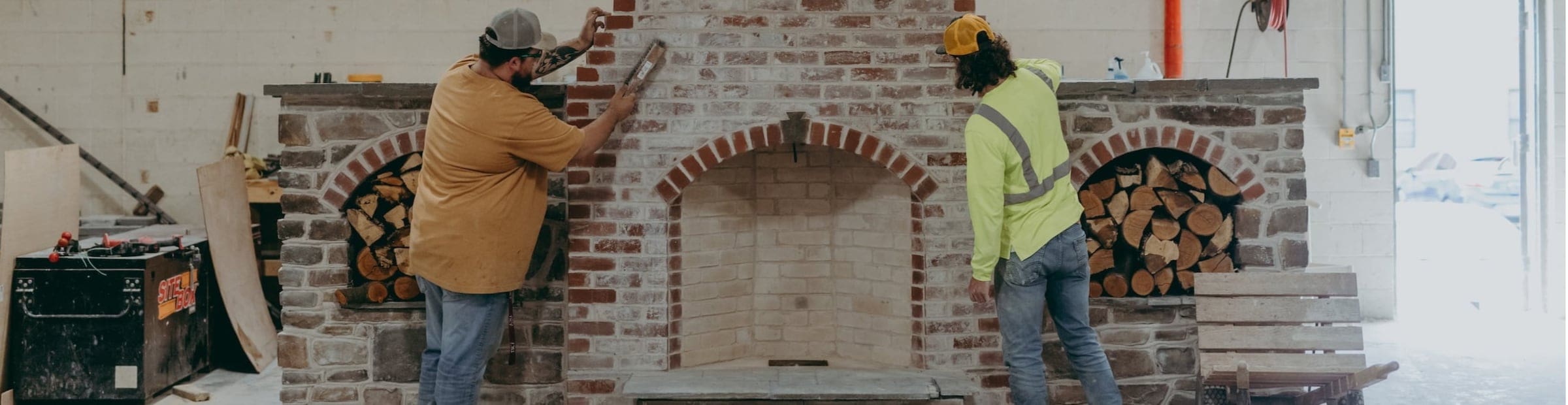 Thaddeus Stevens College Masonry Construction students working on fireplace arch