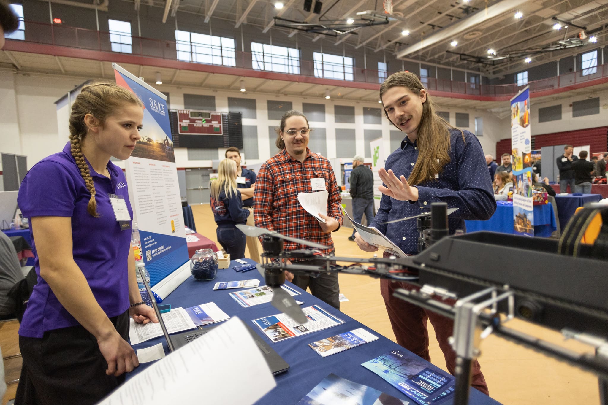 Students speaking with an employer at a Career Fair. 