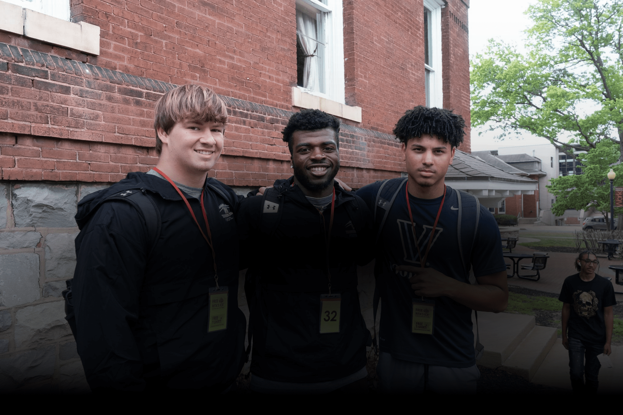 Three students at the start of the school year smiling at the camera at Thaddeus Stevens College. 