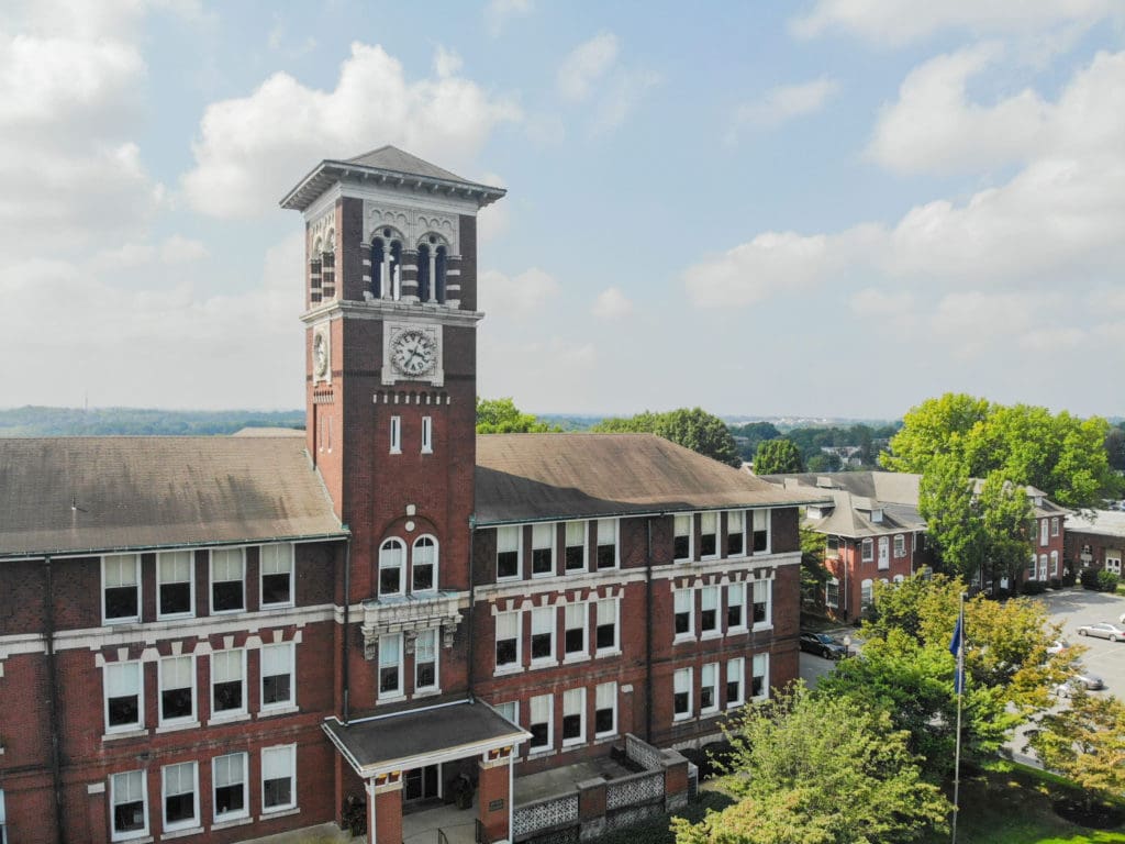 Mellor Building on main campus with lots of sky behind it. 