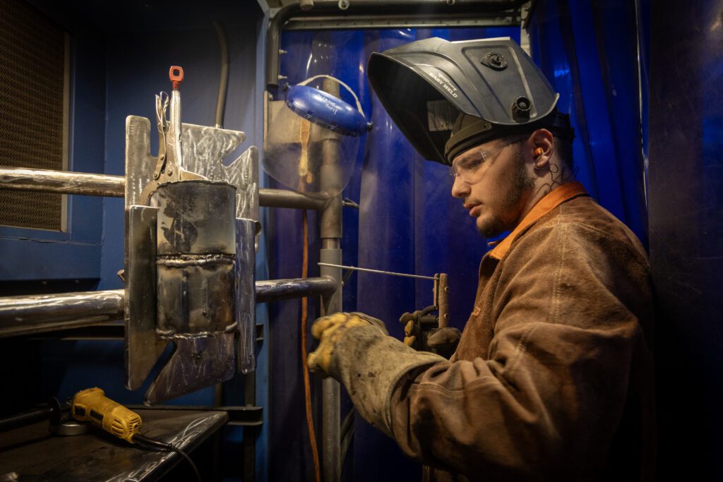 A student in the Advanced Welding Fabrication Technology program ready to weld.